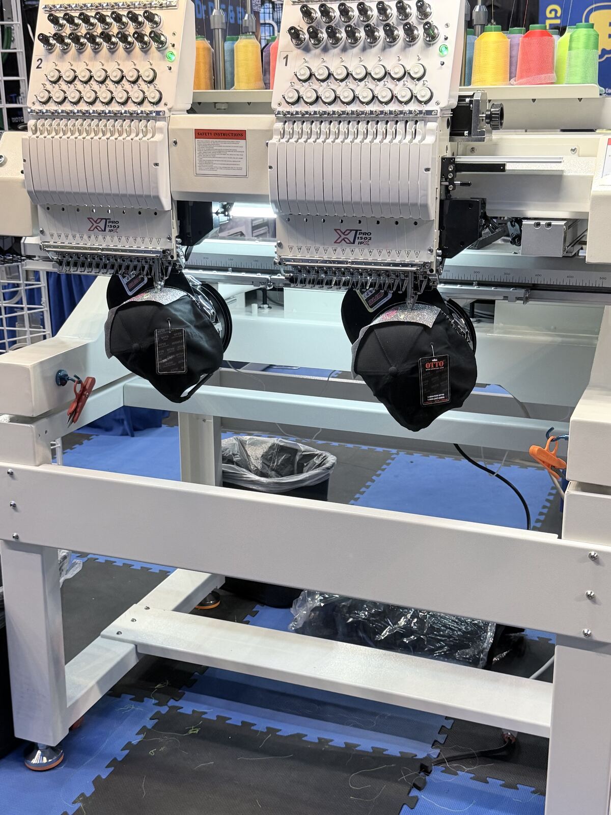 Close-up of a heat press equipment setup with color swatch samples and control panels visible