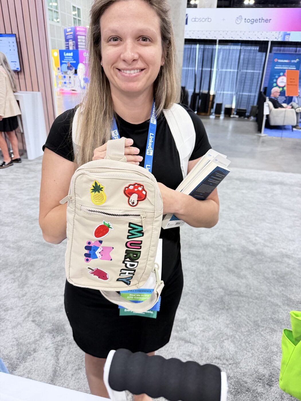 Guest carrying a custom-printed canvas tote