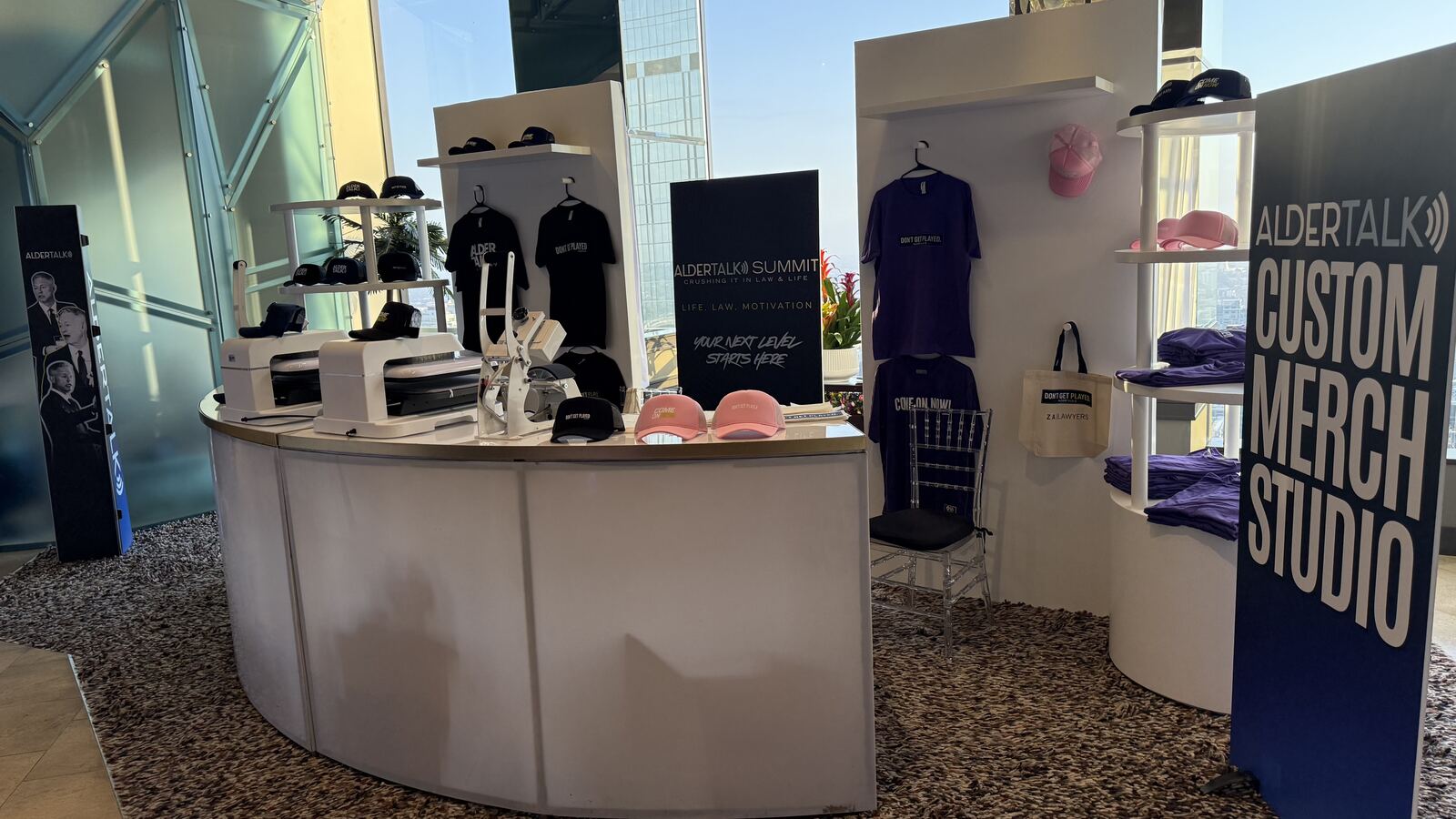 Live demonstration of a heat press transfer being applied to merchandise at a corporate event booth
