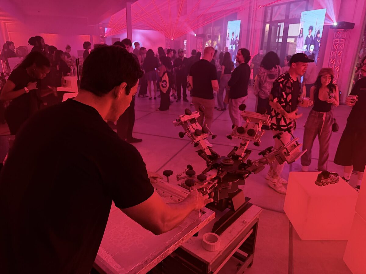 Nighttime brand activation with a live printing bar